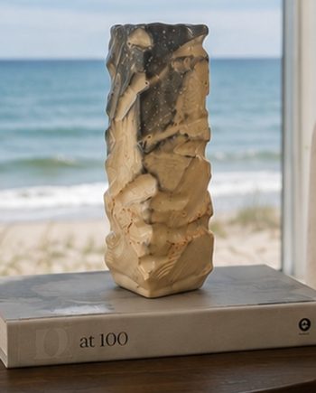 Sculptural ceramic vase displayed in a Lake Michigan interior overlooking the water