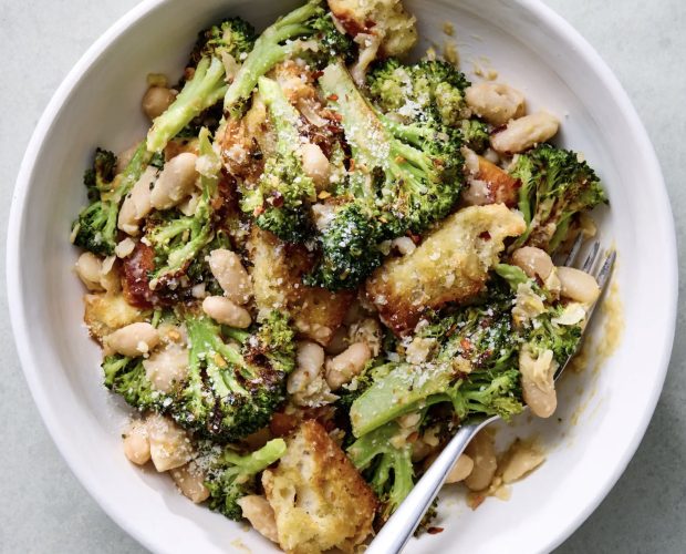 a bowl of broccoli and white bean caesar salad