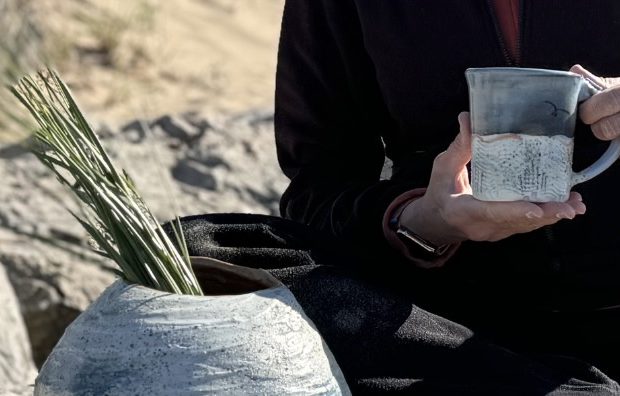 Lake Michigan shoreline with soft light and sand patterns, reflecting observation and creative process
