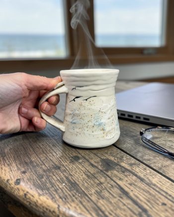 Cream Lake Michigan ceramic mug with beach sand glaze on lower third, Shoreline Light series