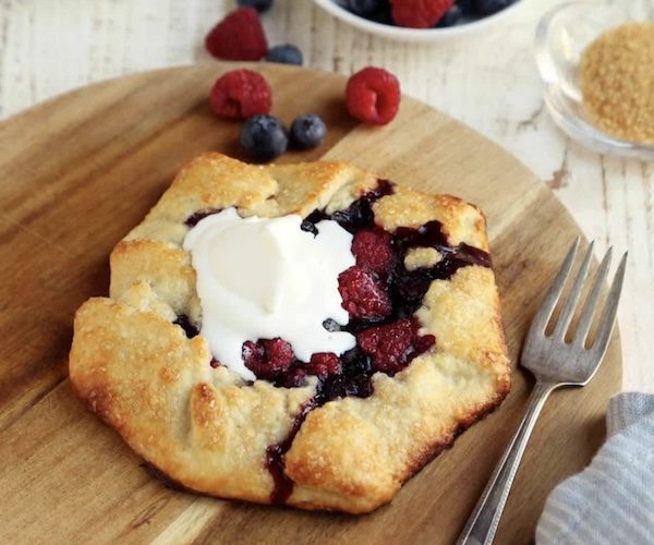ready to eat single serve crostata on a plate with cream